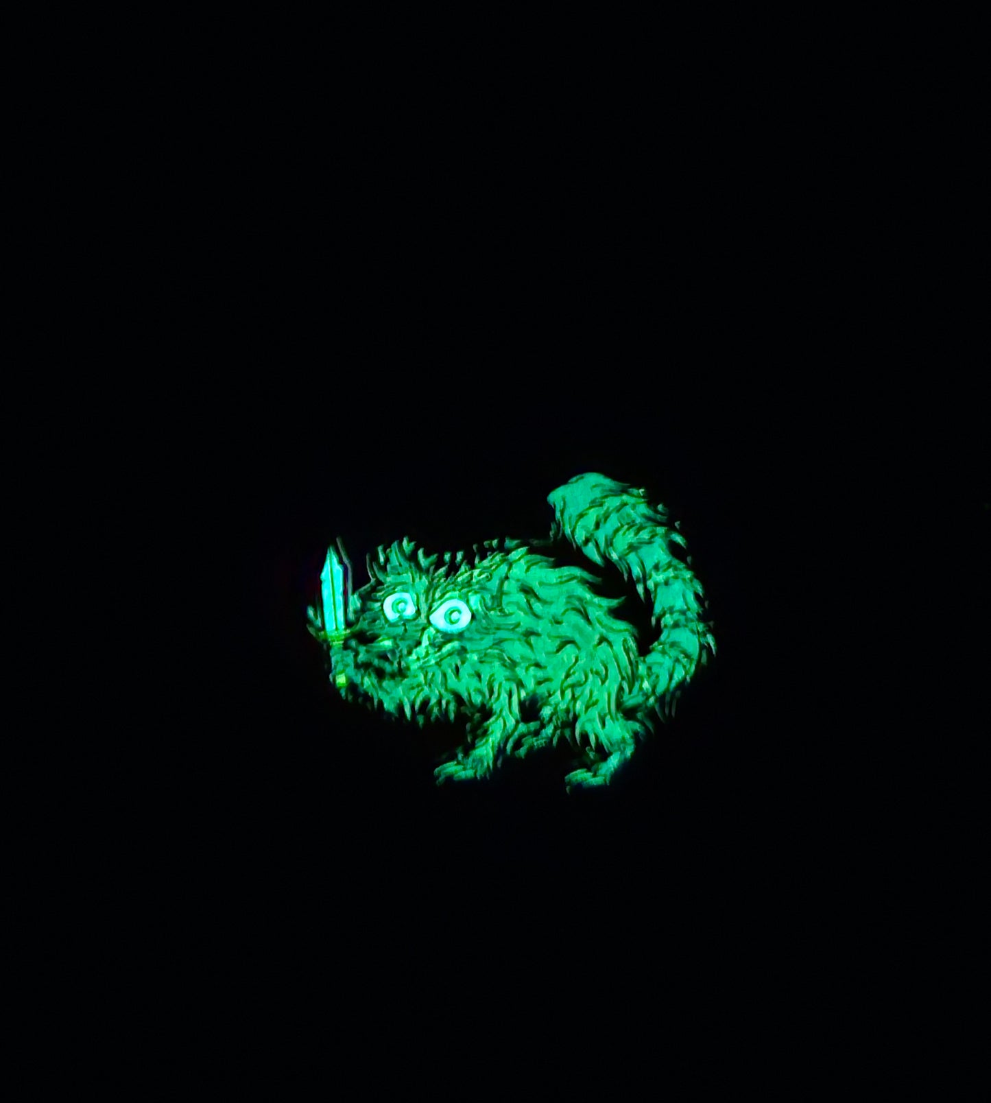 Raccoon Dagger 1.5 Inch Glow In The Dark Pin